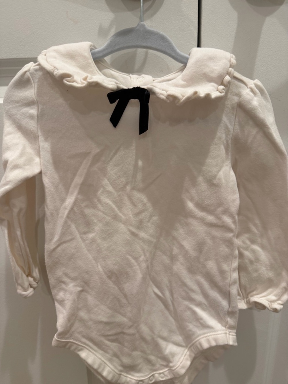 Janie and Jack Cream Long-Sleeve Ruffle Collar Bodysuit with Black Bow